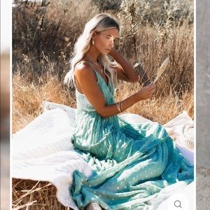 VICI fathoms below metallic dress!